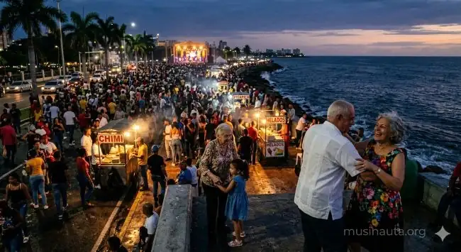 Multitud bailando merengue en el malecón de Santo Domingo al atardecer con el mar Caribe de fondo